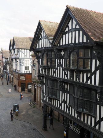 Photo for Chester. Cheshire, United Kingdom - 20 March 2024 : View of old half timbered buildings on Foregate street in Chester taken from the city walls - Royalty Free Image