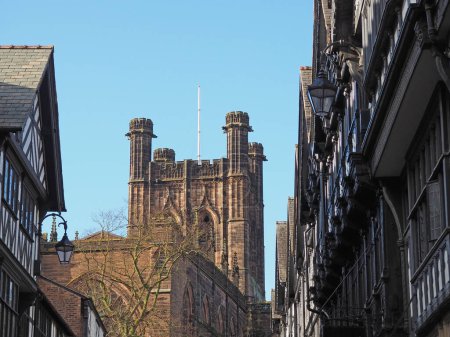 Old timber framed tudor style buildings and the cathedral in St Werburgh street Chester
