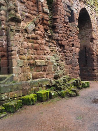 Ruined medieval stone walls of the eastern end of destroyed choir and tower of St Johns church in Chester