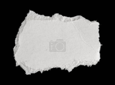 Foto de Un pedazo de papel blanco sobre un fondo negro aislado - Imagen libre de derechos