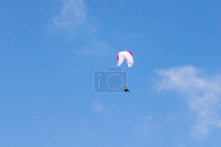 paraglider against the blue sky
