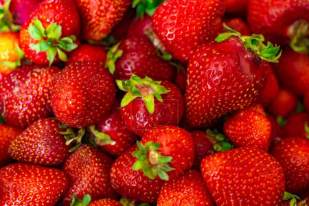 red strawberries with visible details. background or texture