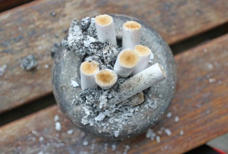 Photo for The ashtray is full of cigarette butts. - Royalty Free Image