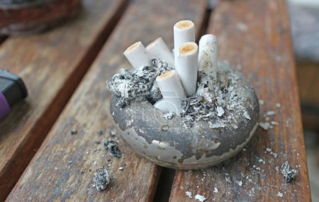 Photo for The ashtray is full of cigarette butts. - Royalty Free Image