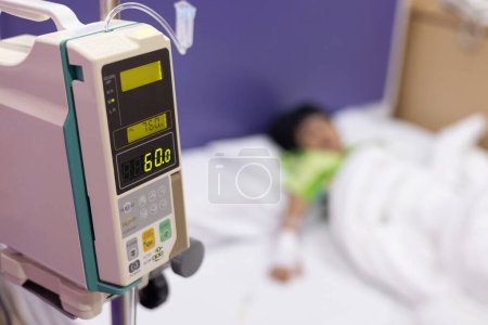 Photo for Child's hand fever patients have IV tube in hospital. Toddler girl wearing IV tube sleep in icu emergency bed room for leukemia coma from Cancer, Pediatric, Dengue fever. Sick children, infected. - Royalty Free Image