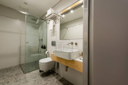 interior of modern white bathroom with sink and toilet  