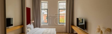 Photo for Blank envelope on comfortable bed in modern hotel room, banner - Royalty Free Image