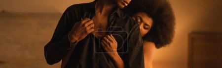 Photo for Partial view of man in black shirt near curly african american woman with closed eyes, banner - Royalty Free Image