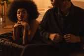 seductive african american woman looking at boyfriend in black shirt undressing in bedroom magic mug #637252910