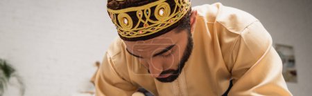 Photo for Muslim man praying during ramadan at home, banner - Royalty Free Image