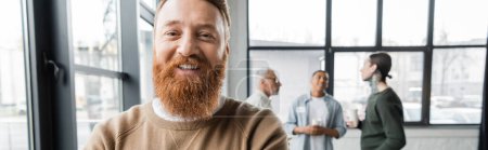 Bearded man looking at camera during alcoholics meeting in rehab center, banner 
