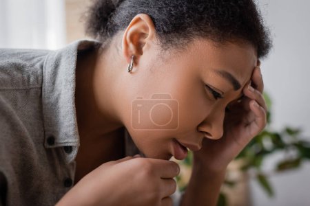 Photo for Frustrated young multiracial woman with depression at home - Royalty Free Image