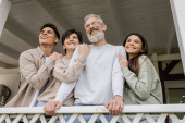 celebration of parents day, middle aged parents hugging with happy daughter and son on porch of summer house, looking away, dreams, family reunion, bonding, modern parenting, moments to remember  puzzle #662762334
