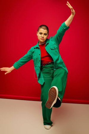 fashion forward, vibrant backdrop, young woman in stylish attire gesturing while posing on red background, full length, generation z, youth culture, personal style, curvy fashion 