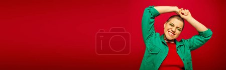 positive vibe, generation z, youth culture, young woman with short hair smiling with closed eyes on red background, fashion statement, youth culture, casual wear, vibrant background, banner 