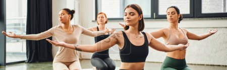 diverse multicultural female friends in sportswear practicing yoga and meditating with closed eyes and outstretched hands, inner peace and body awareness concept, banner
