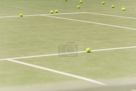 Photo for Nobody on shot, tennis balls on spacious court, blurred foreground, summer, sport and leisure - Royalty Free Image