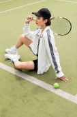 woman in sportswear and cap sitting on tennis court, ball and racket, female tennis player, sport Tank Top #665316192