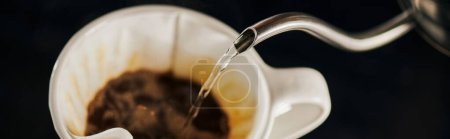 Photo for Boiling water pouring from kettle into ceramic dripper with coffee in filter, V-60 espresso, banner - Royalty Free Image