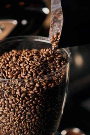 coffee shop, aromatic and whole roasted coffee beans for espresso preparation