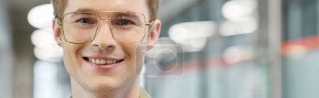 Photo for Professional headshot of joyful entrepreneur in eyeglasses smiling at camera in office, banner - Royalty Free Image
