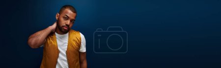 Photo for African american man in trendy vest with hand behind neck and raised brow, fashion concept, banner - Royalty Free Image