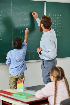 A male teacher educates a group of children in a lively classroom setting, captivated by his instruction and enthusiasm.