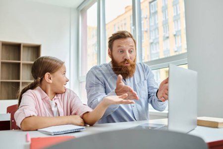 Photo for A man, acting as a teacher, attentively guides a young girl while they sit together at a desk in a bright, lively classroom setting. - Royalty Free Image