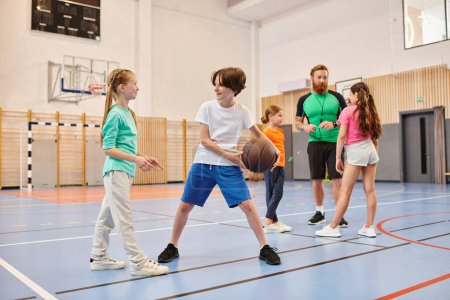Photo for A diverse group of young people energetically playing a game of basketball, dribbling, passing, and shooting on a sunny court. - Royalty Free Image