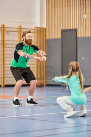 A man and a little girl are immersed in physical education class in school gym