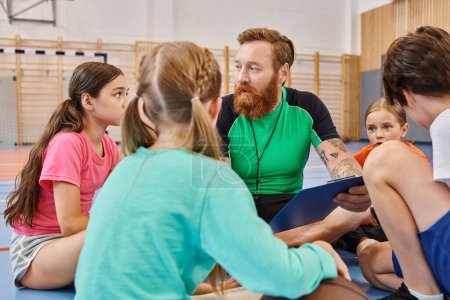 Photo for A diverse group of people, including children and their male teacher, are seated around each other in a gym, engaged in a lively and vibrant learning session. - Royalty Free Image