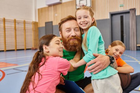 A bearded teacher with open arms, warmly hugging a diverse group of children in a vibrant classroom setting filled with laughter and joy.