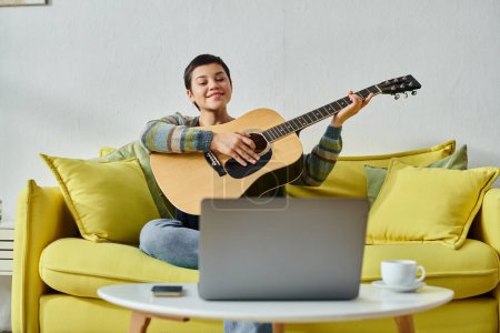 joyous attractive woman in casual homewear attending online guitar lesson, education at home