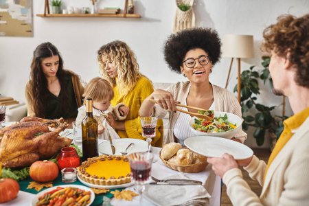 happy family enjoying delicious dinner while gathering on Thanksgiving, roasted turkey on table