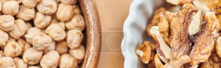 top close up view of high-calorie chickpeas and walnuts in bowls, plant-based diets concept, banner