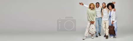 Photo for Good looking young friends in casual attires with backpacks smiling ta camera, students, banner - Royalty Free Image