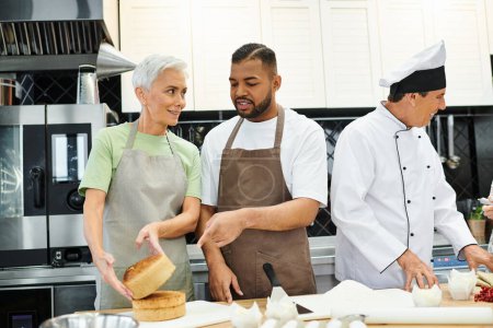 jolly mature woman smiling at african american man while baking next to their chef, cooking courses