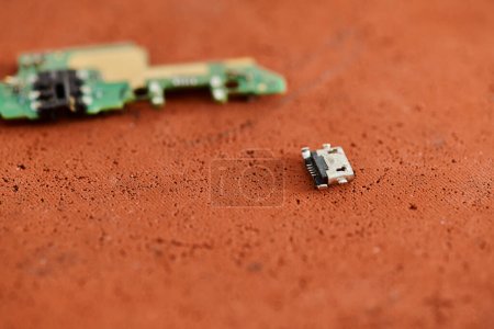 Photo for Different spare parts for electronic equipment on table in repair workshop, maintenances business - Royalty Free Image