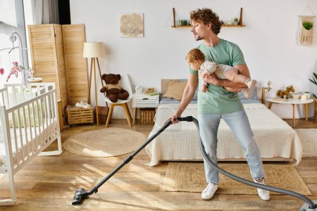 curly man multitasking housework and childcare, father vacuuming bedroom with infant boy in arms