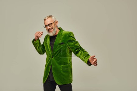 joyous handsome cool mature male model with gray beard and glasses smiling happily at camera