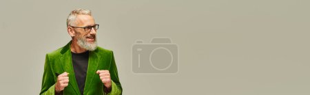 Photo for Good looking mature cheerful male model in vibrant stylish attire smiling and looking away, banner - Royalty Free Image