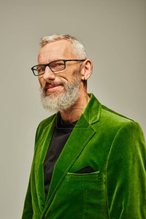 Photo for Handsome gray bearded mature man in green stylish blazer with accessories smiling at camera - Royalty Free Image