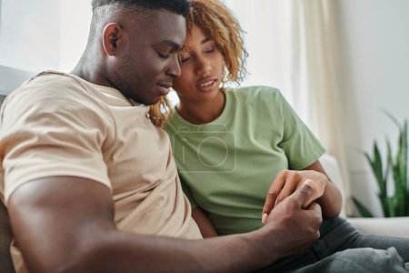 Photo for Tender moment between african american couple at home, bonding and closeness between man and woman - Royalty Free Image