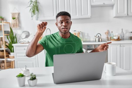 Photo for Deaf african american freelancer using sign language during video call on laptop at home, explain - Royalty Free Image