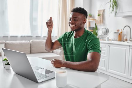 Photo for Happy deaf african american remote worker using sign language during online meeting on laptop - Royalty Free Image