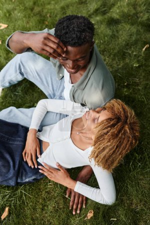 Photo for Top view of african american man using sign language for communication with girlfriend in park - Royalty Free Image