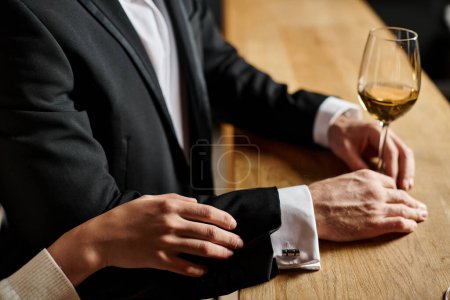 Photo for Cropped view of woman touching hand of man in suit during date on Valentine`s day, romance and love - Royalty Free Image