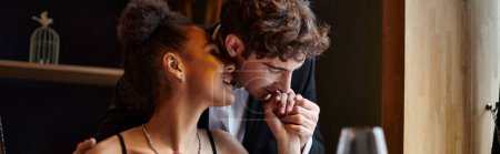 Photo for Gentleman kissing hand of happy african american woman during date on Valentines day, banner - Royalty Free Image