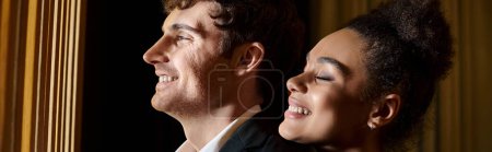cheerful african american woman hugging shoulders of handsome man during date, romance banner