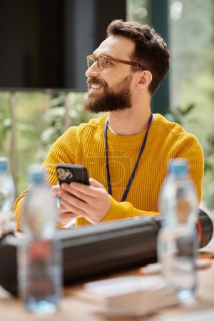 Photo for Cheerful handsome architect in yellow turtleneck working on his startup and looking away in office - Royalty Free Image